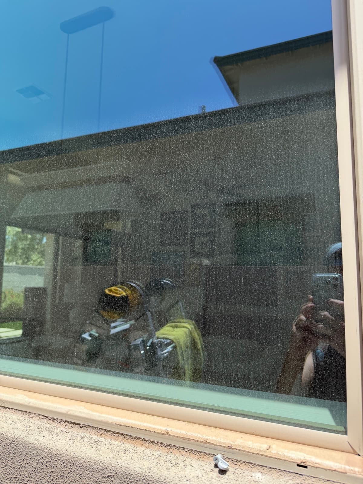 Window glass hazy with construction film and spots before cleaning