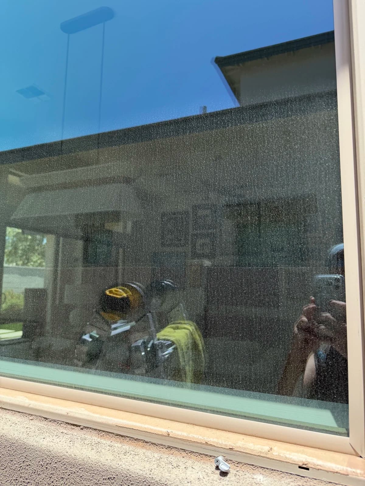 Window glass hazy with construction film and spots before cleaning
