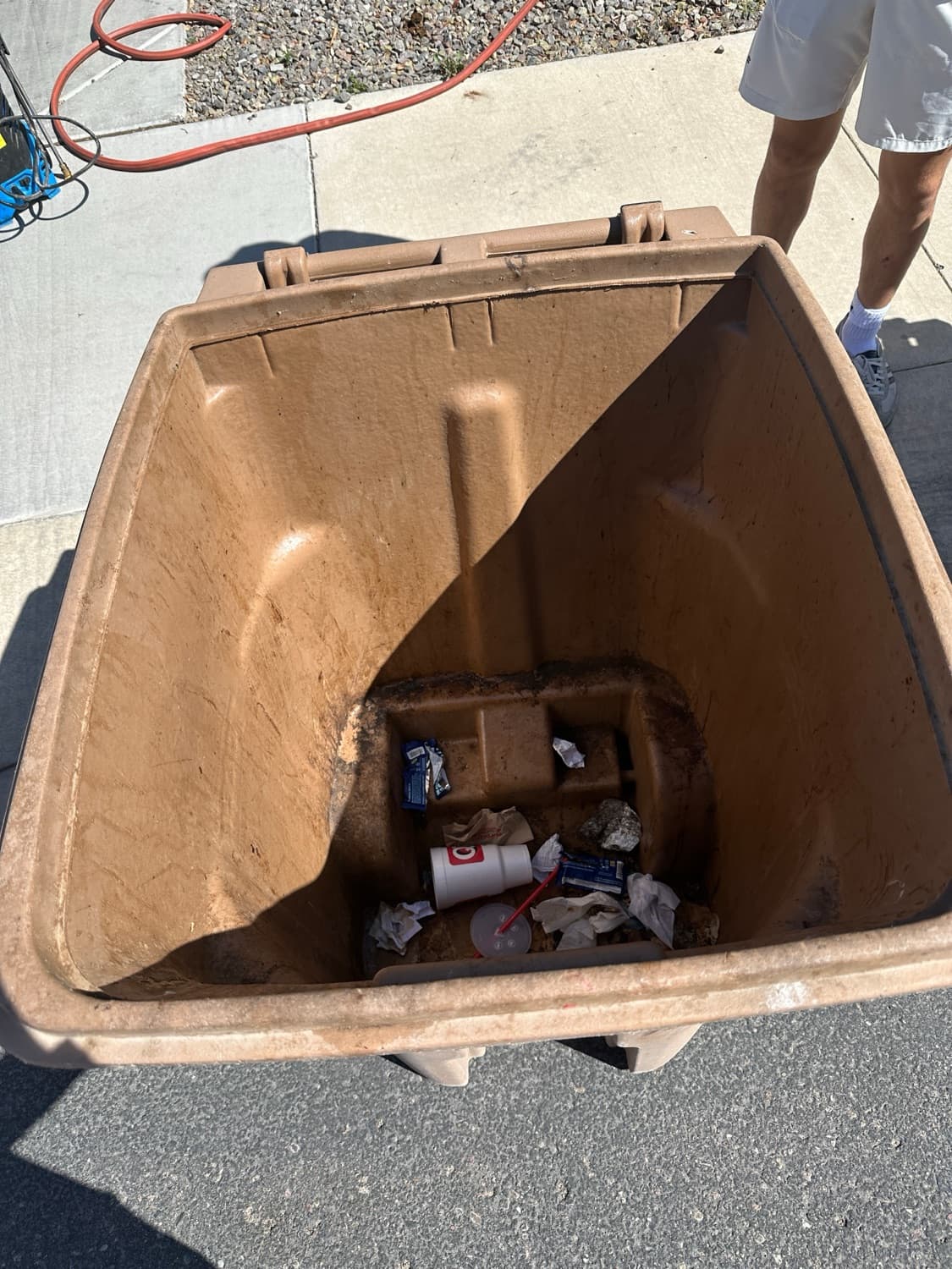Dirty, food-caked trash bin before Valley Shine Pro cleaned it