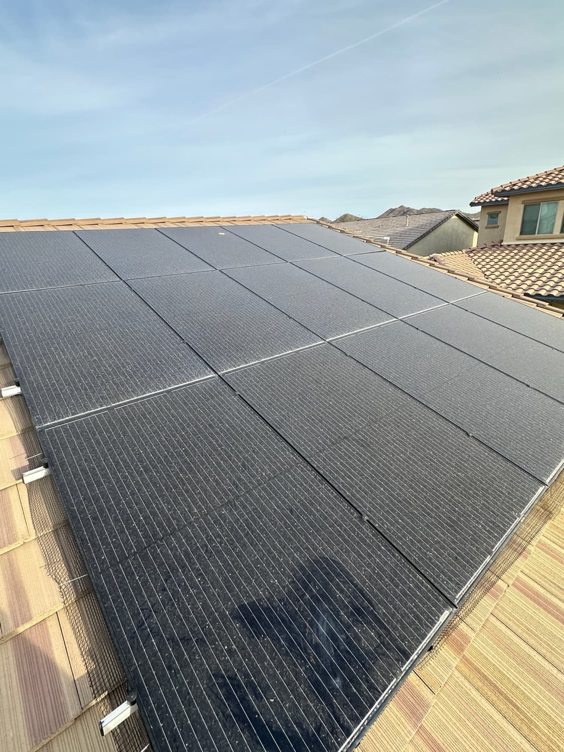 Dust-caked solar panels losing production before cleaning