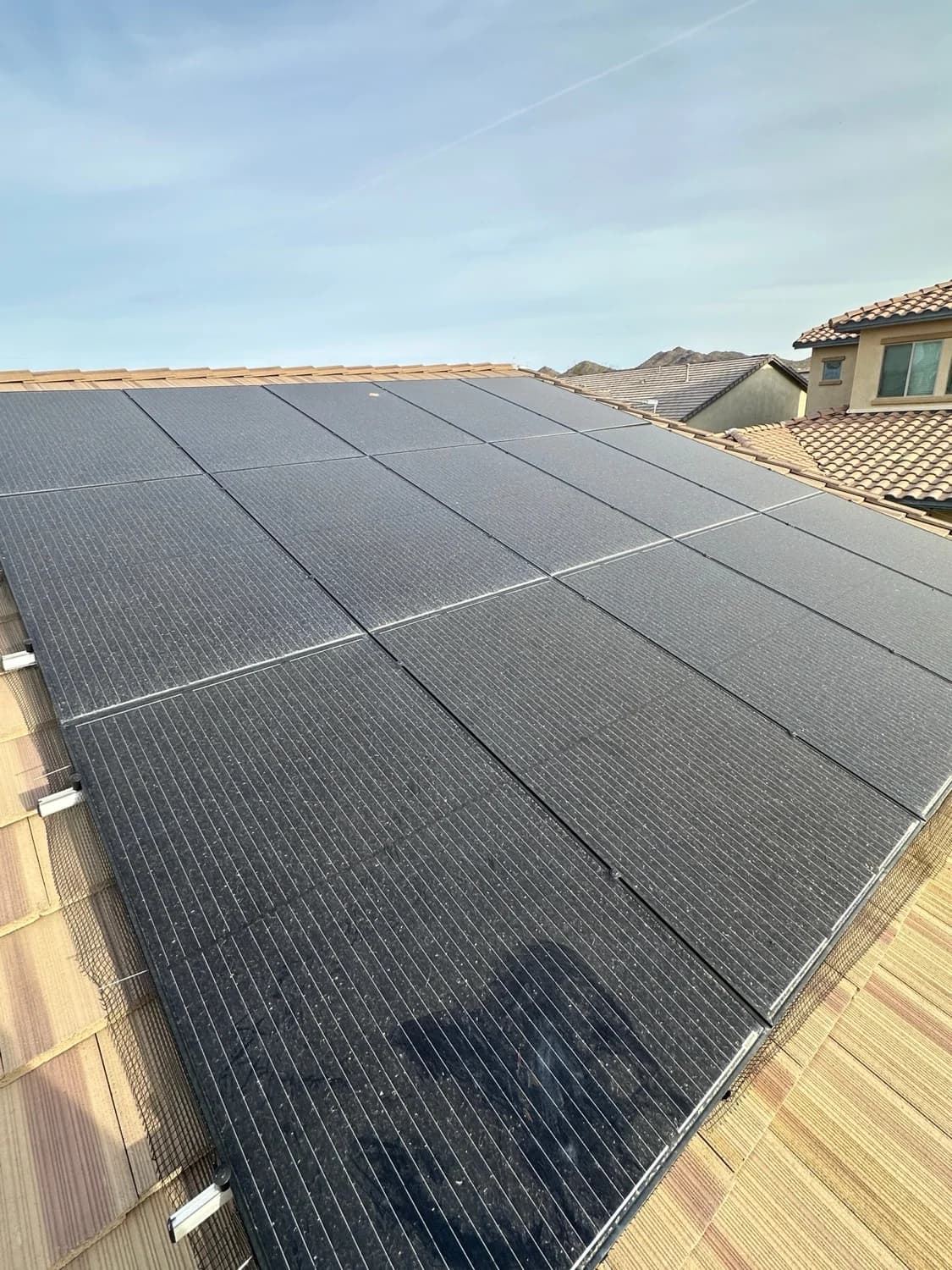 Dust-caked solar panels losing production before cleaning