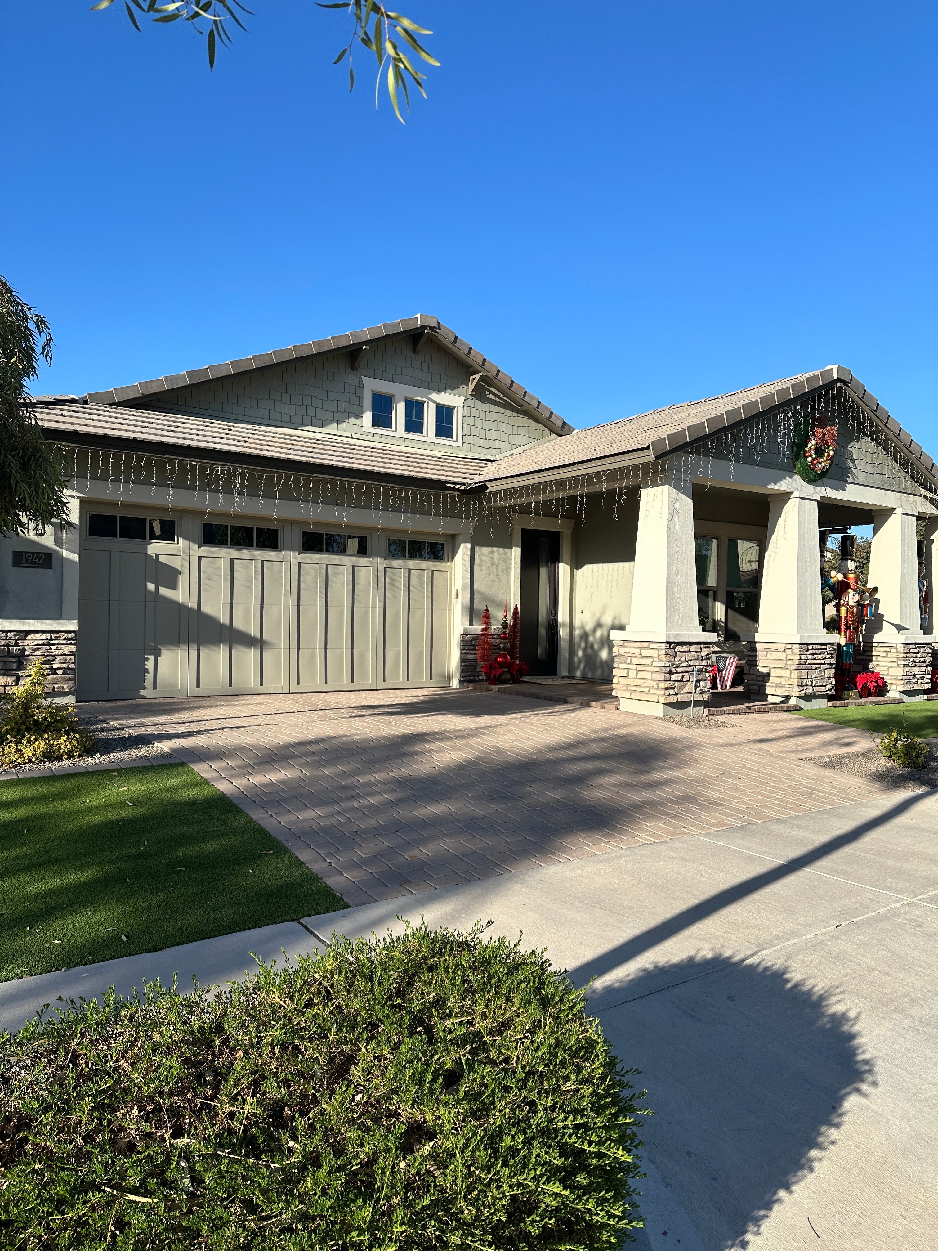 Pressure washing luxury home driveway